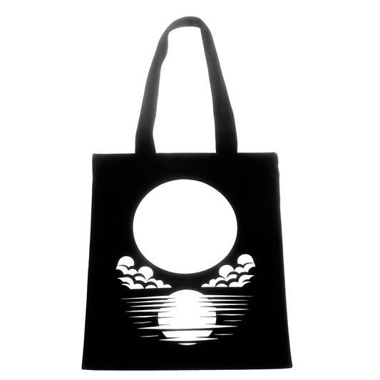 Black tote bag with white moon logo and waves print.